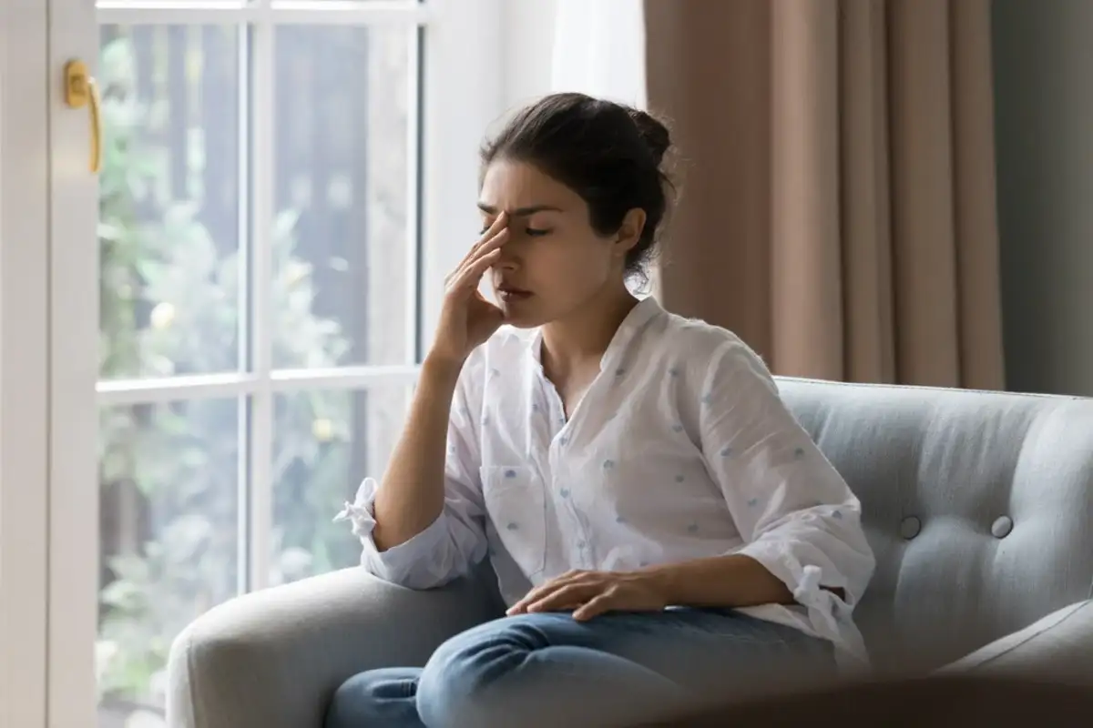 young woman with a headache