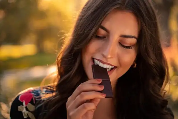 Woman eating chocolate