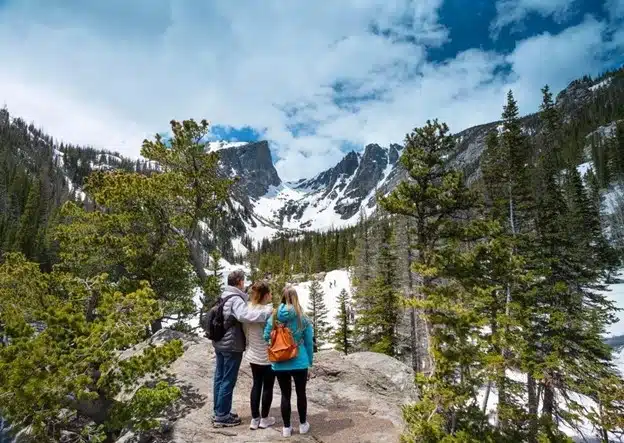 family admiring the view in the mountains