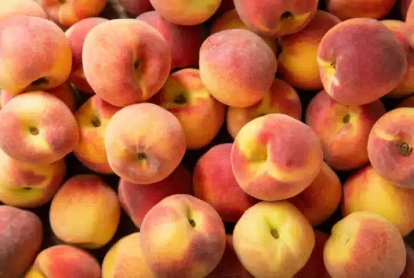 Fresh ripe peaches as background