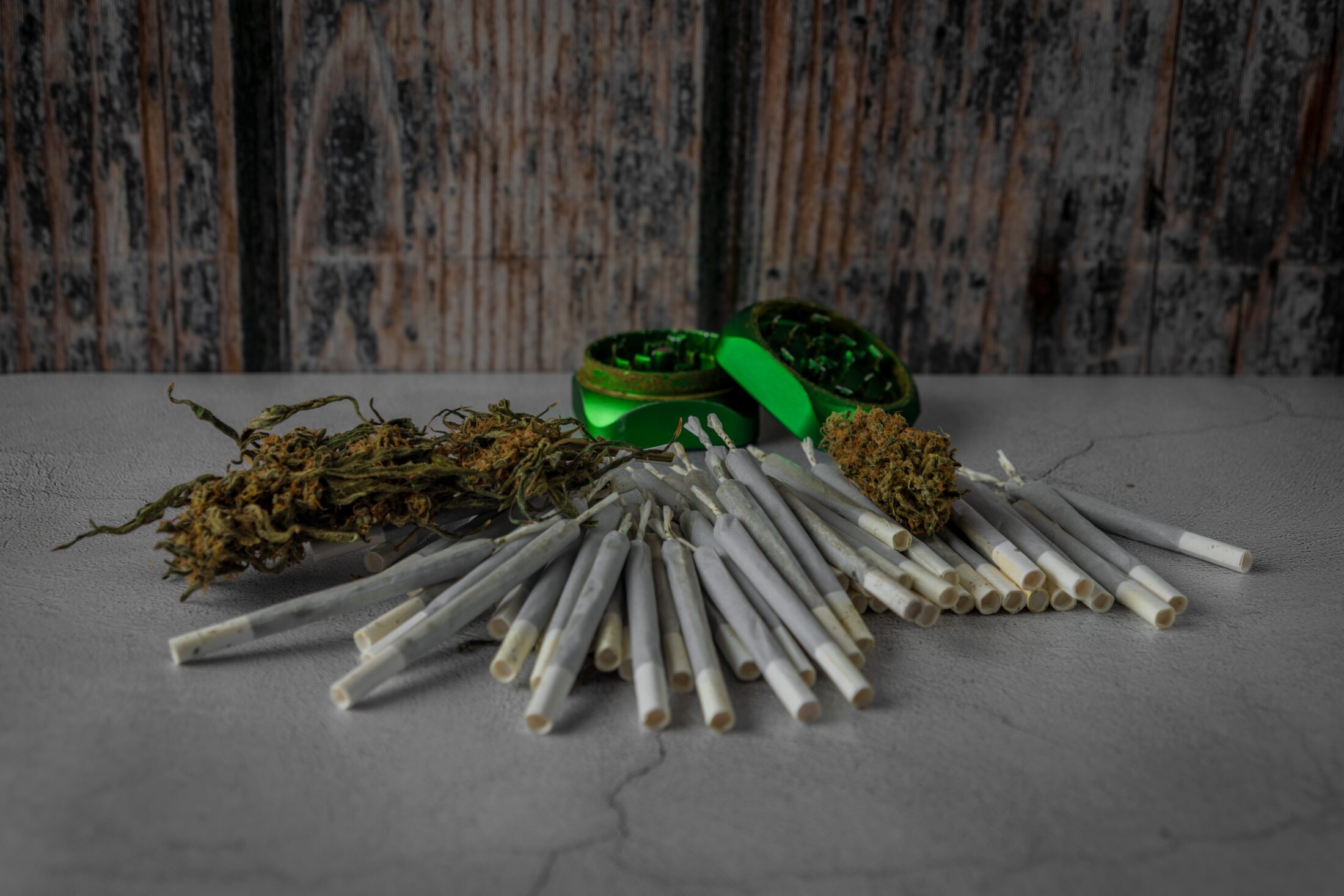 Marijuana Paper Joints On Whte Concrete Floor