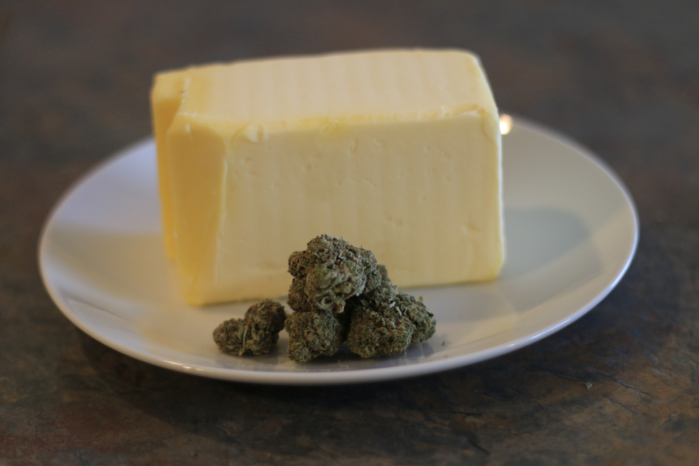 Cannabutter Process Of Making Buds Of Marijuana In Front Of